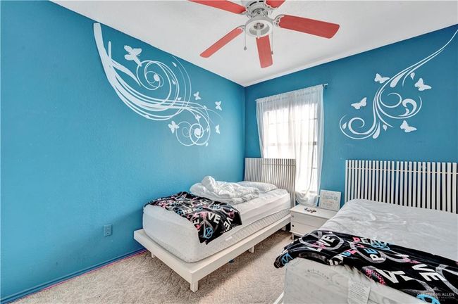 Carpeted bedroom featuring ceiling fan | Image 10