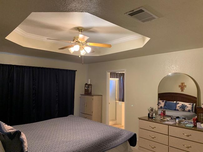 Master bedroom is large with great cutout ceiling design. | Image 16