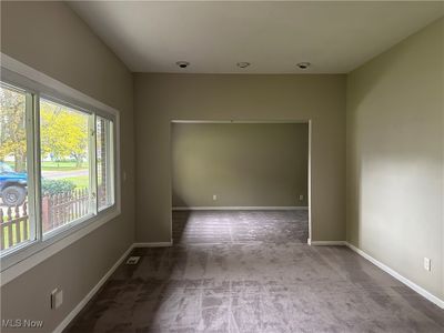 Empty room featuring light colored carpet | Image 2