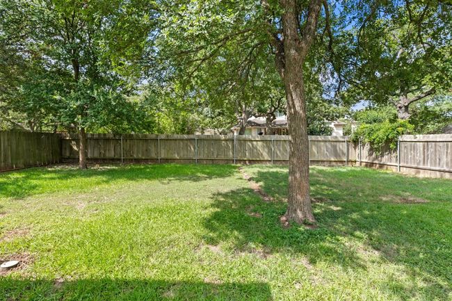View of fenced backyard | Image 34
