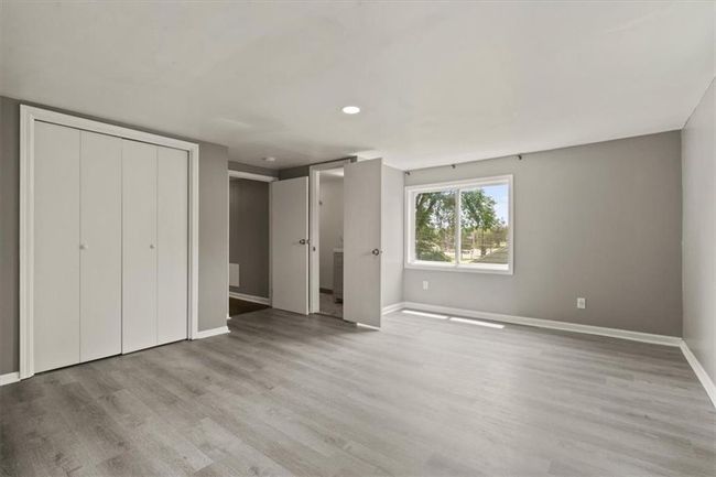 Unfurnished bedroom with light wood-type flooring, recessed lighting, and a closet | Image 20