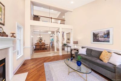 Living room with cathedral ceilings and hardwood floors - view to Dining room | Image 3