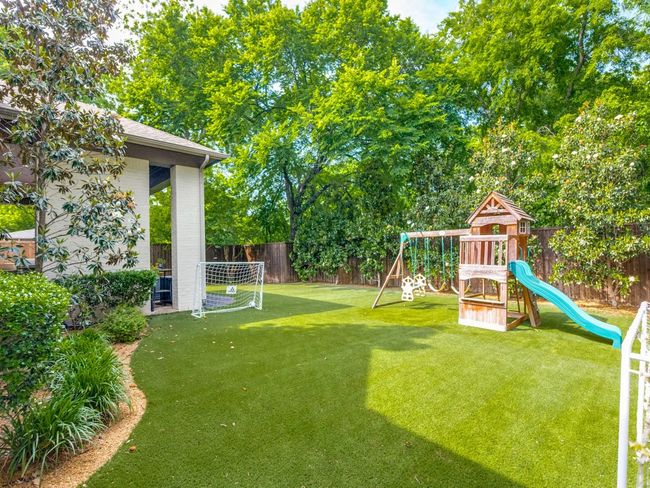 View of yard with a playground | Image 19