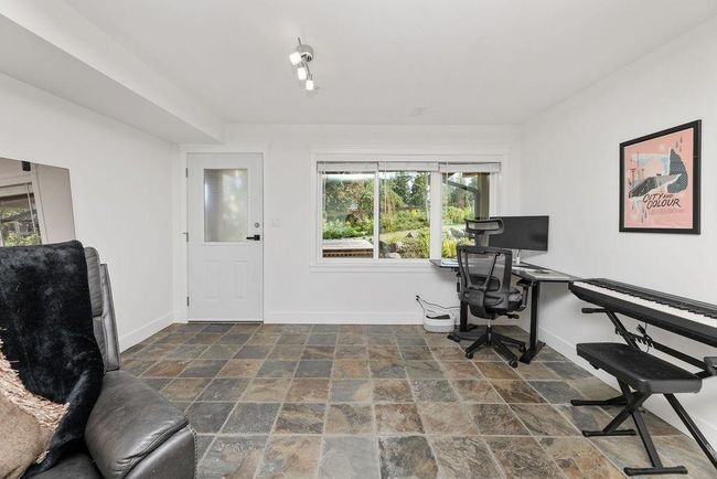 Downstairs recreation area/family room that could be converted to a third bedroom or used as a home business with separate entry | Image 32