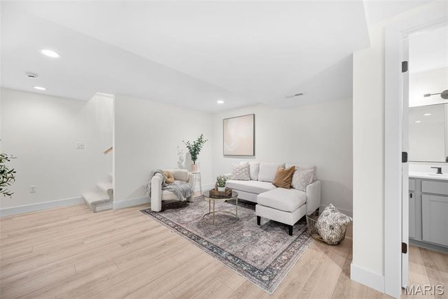 Living area featuring stairs, light wood-type flooring, and recessed lighting | Image 34