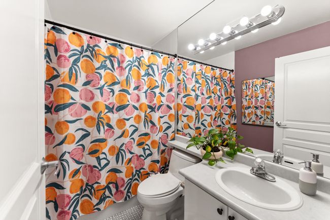 Full bath with toilet, vanity, and a shower with curtain | Image 30