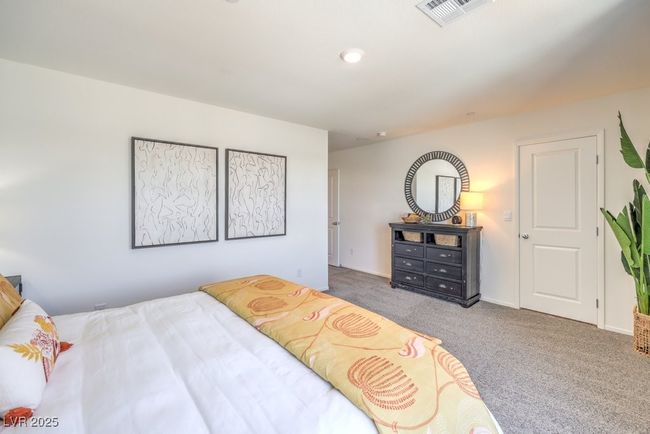 Bedroom featuring visible vents and carpet flooring | Image 24