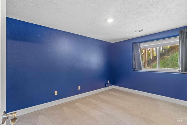 Unfurnished room with carpet and a textured ceiling | Image 28
