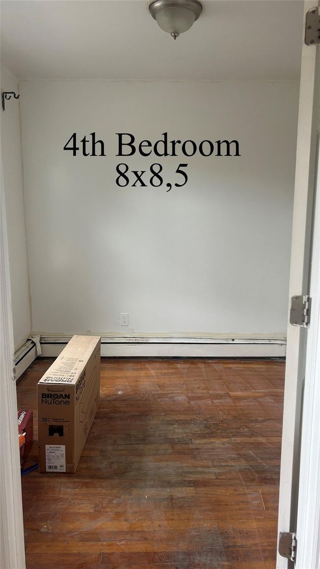 Hallway with dark wood finished floors | Image 4