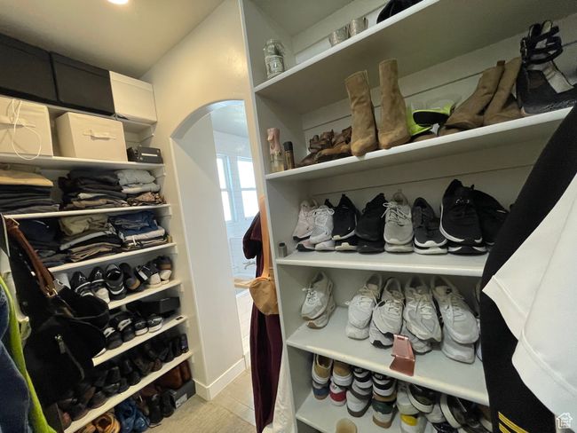 Spacious closet featuring arched walkways | Image 37