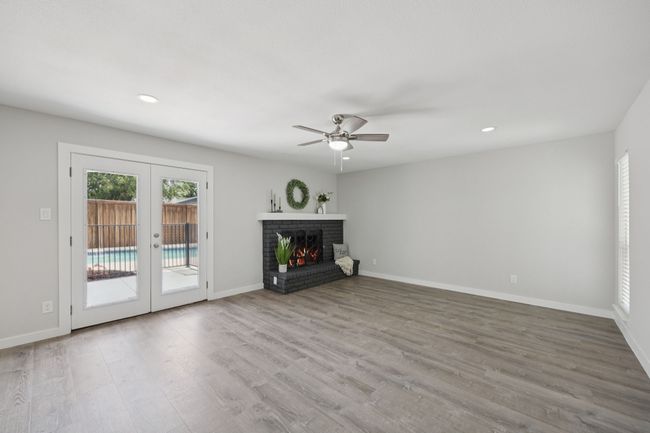 Love the views to the Backyard and Pool, the impressive flooring, new ceiling fan and recessed lighting! | Image 20