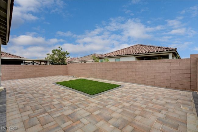 Fenced backyard featuring a patio | Image 33