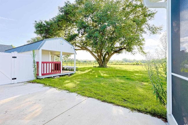 View of yard with a gate | Image 25
