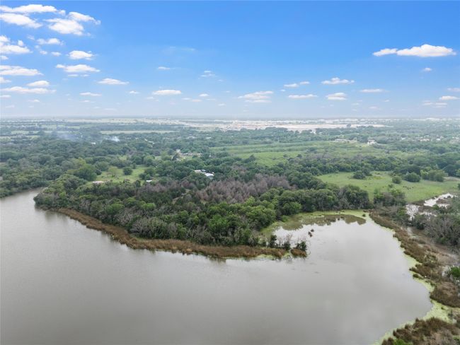 Bird's eye view featuring a water view and a view of trees | Image 4