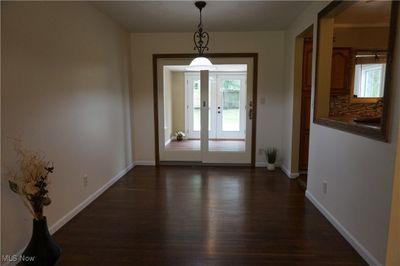 Unfurnished dining area with dark hardwood / wood-style floors and french doors | Image 3