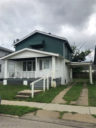 1703 Crestline featuring a porch and a front lawn | Image 1