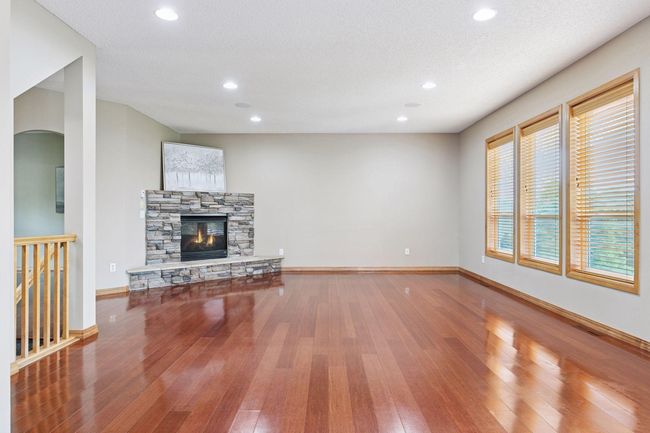 Stacked stone fireplace off of living room on main floor. | Image 4