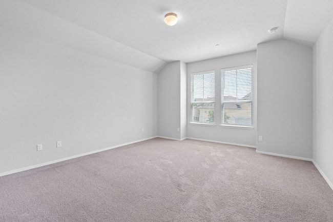 Additional living space featuring vaulted ceiling and light colored carpet | Image 18
