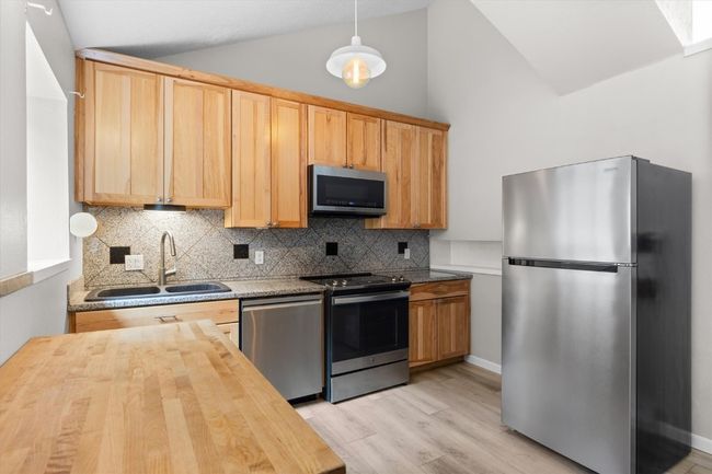 Spacious kitchen w/butcher block and granite tile | Image 5