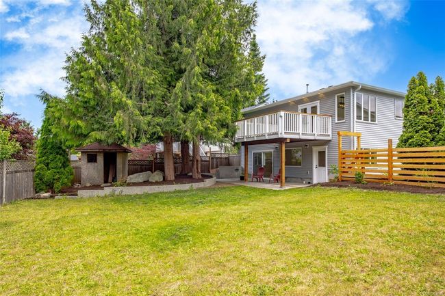 Fully fenced backyard with Garden shed | Image 94