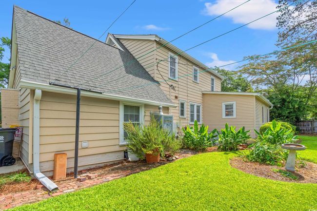 Rear view of property with roof with shingles | Image 24
