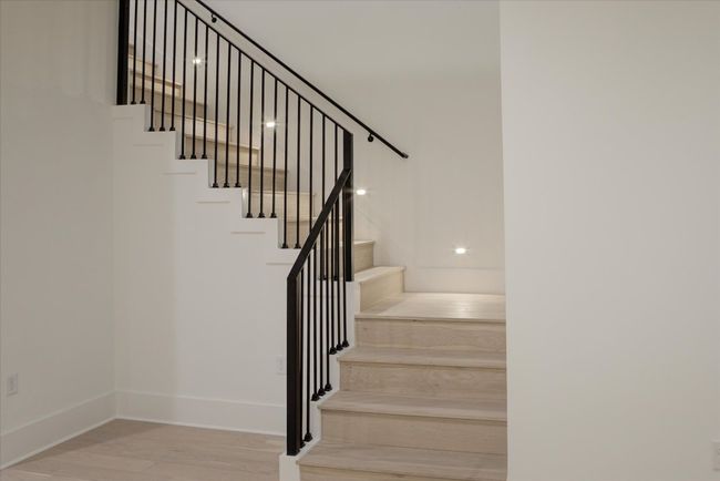 The architect/builder placed thoughtful custom touches throughout the home, like the staircase lighting. | Image 19