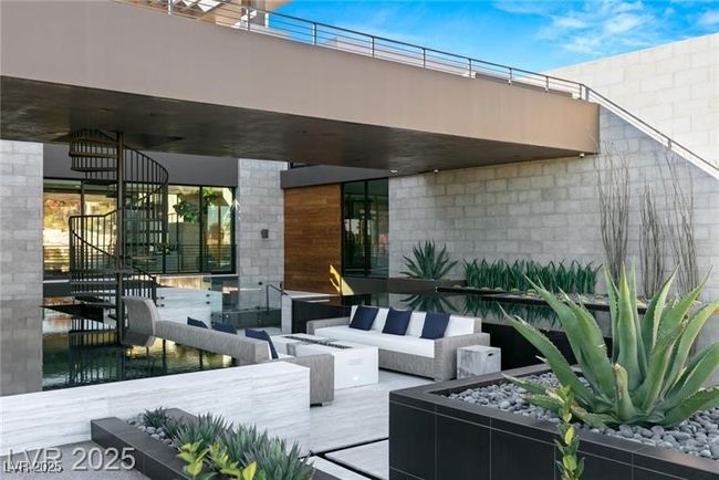 View of patio / terrace with an outdoor living space with a fire pit | Image 11