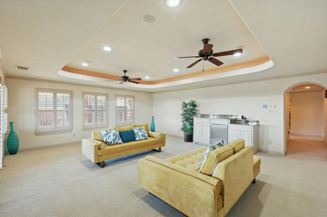 The top floor gameroom has a wet bar and icemaker | Image 25