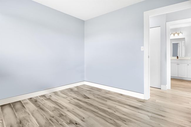 Spare room with baseboards and light wood finished floors | Image 19