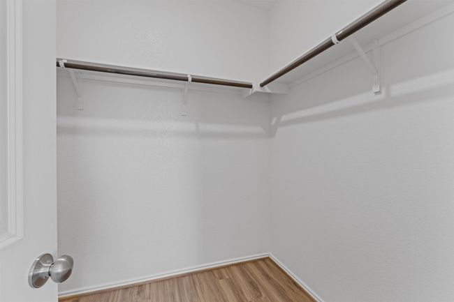Spacious closet featuring wood finished floors | Image 17