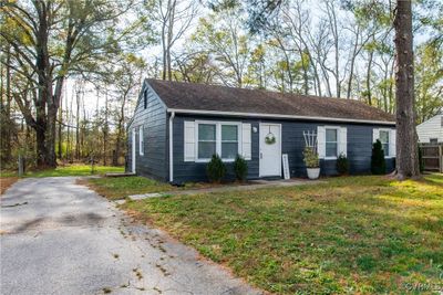 View of front facade with a front yard | Image 1