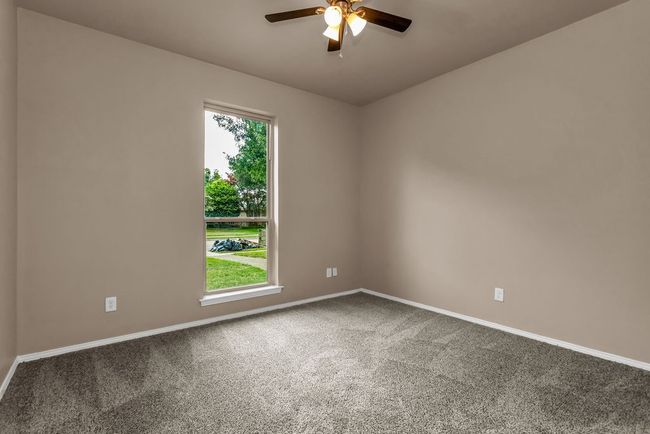 Carpeted spare room featuring ceiling fan and healthy amount of natural light | Image 20