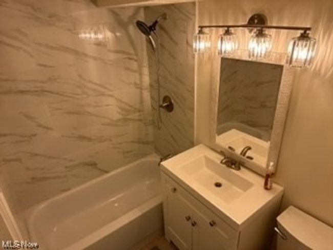 2nd Full bathroom with tiled shower / bath combo, toilet, and vanity with extensive cabinet space | Image 15