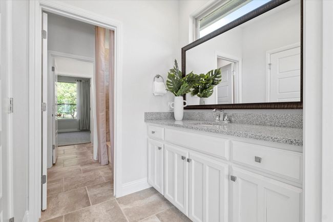 Full bathroom with vanity and stone finish floors | Image 24