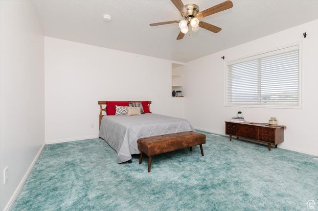 Bedroom with carpet and ceiling fan | Image 27