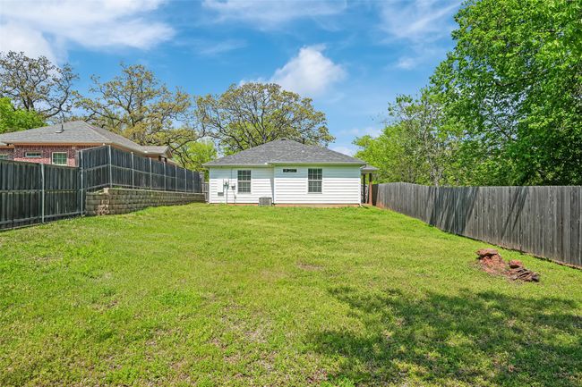 View of yard with a fenced backyard | Image 33