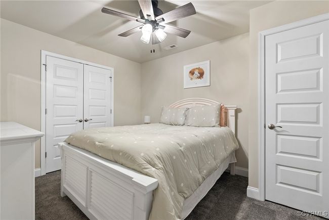 Carpeted bedroom with a closet and ceiling fan | Image 6
