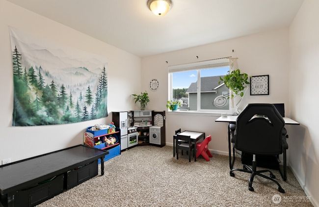 Generously sized secondary bedrooms offer plenty of space for guests, hobbies, or a quiet home office setup. | Image 18