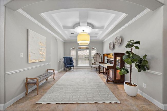 The spacious dining room features premier lighting and an ideal for any gathering. | Image 11