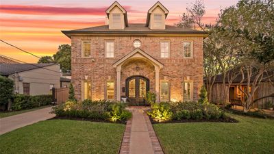 Notice the Illumination of this Wonderful Home, enhanced by the Outdoor Landscape Lighting. Family and Friends will Feel Right at Home when they Enter through the Custom Durango* Forged Iron Double Front Doors. The Front Porch offers a Herringbone Design Brick Floor - Very Stylish! *Per Seller | Image 3