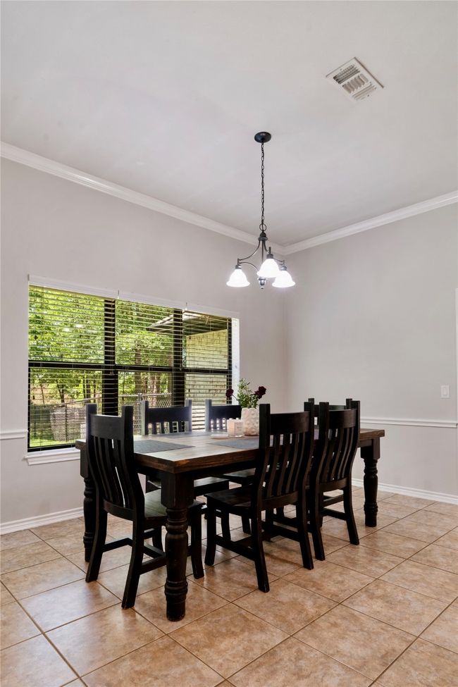 Dining room with plenty of natural light, visible vents, and light tile patterned floors | Image 7