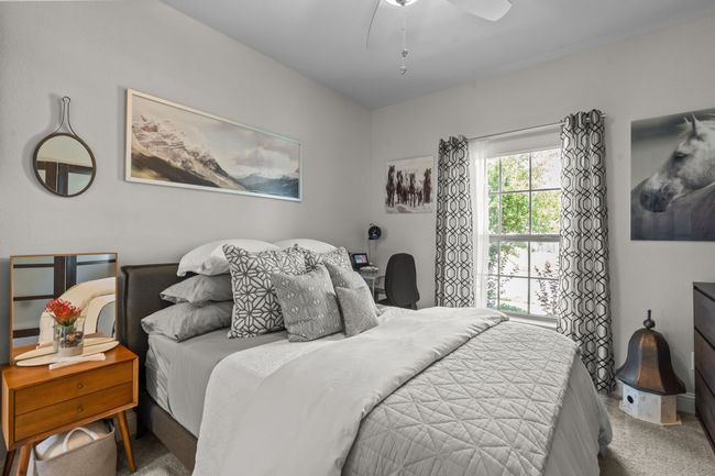 Carpeted bedroom featuring ceiling fan | Image 23