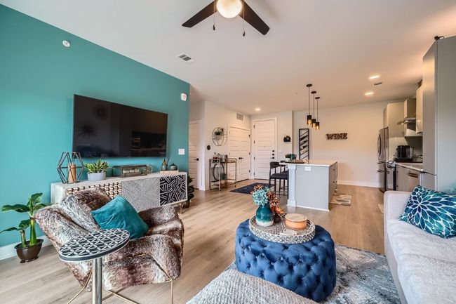 Living area featuring ceiling fan, light wood-style floors, and recessed lighting | Image 6