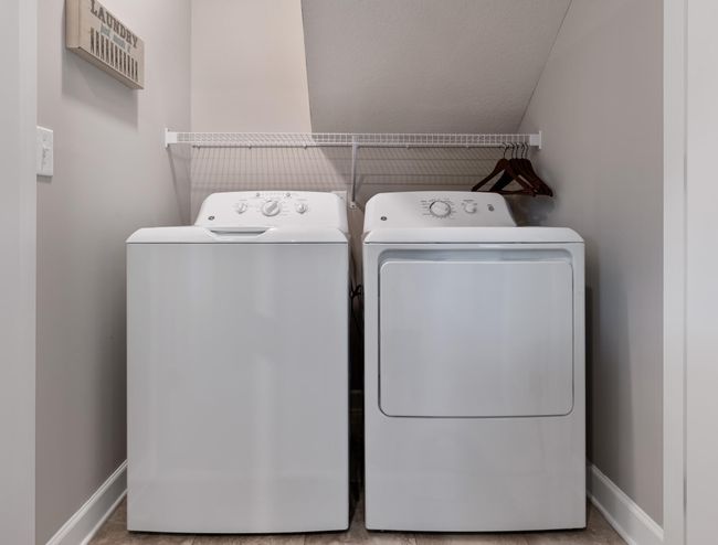 (Photo of decorated model, actual home's finishes will vary) Located in the basement is a laundry room to get chores finished and keep messes out of sight. | Image 22