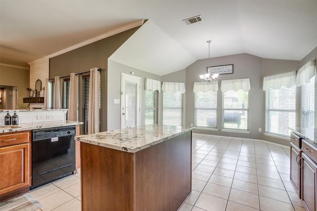 Kitchen with island. | Image 20
