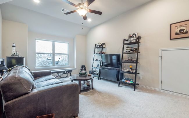Another view of the upstairs living room. | Image 16