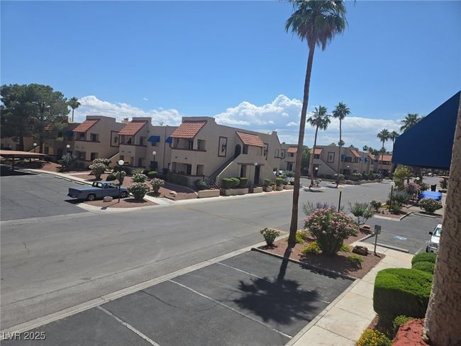 View of asphalt road with a residential view, sidewalks, and curbs | Image 14
