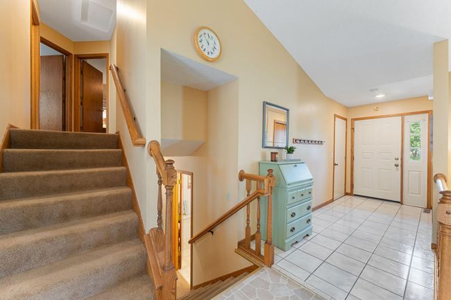 Spacious entry way leads to garage, upper, and lower levels. | Image 6
