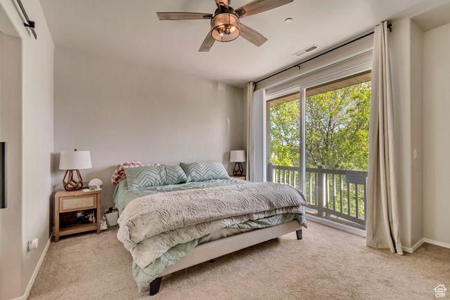 Bedroom featuring visible vents, a ceiling fan, baseboards, access to outside, and carpet flooring | Image 8