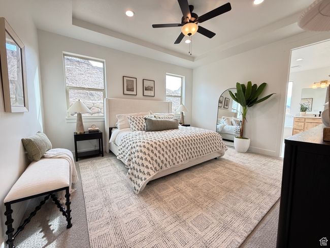 Bedroom featuring baseboards, recessed lighting, a raised ceiling, and light colored carpet | Image 12